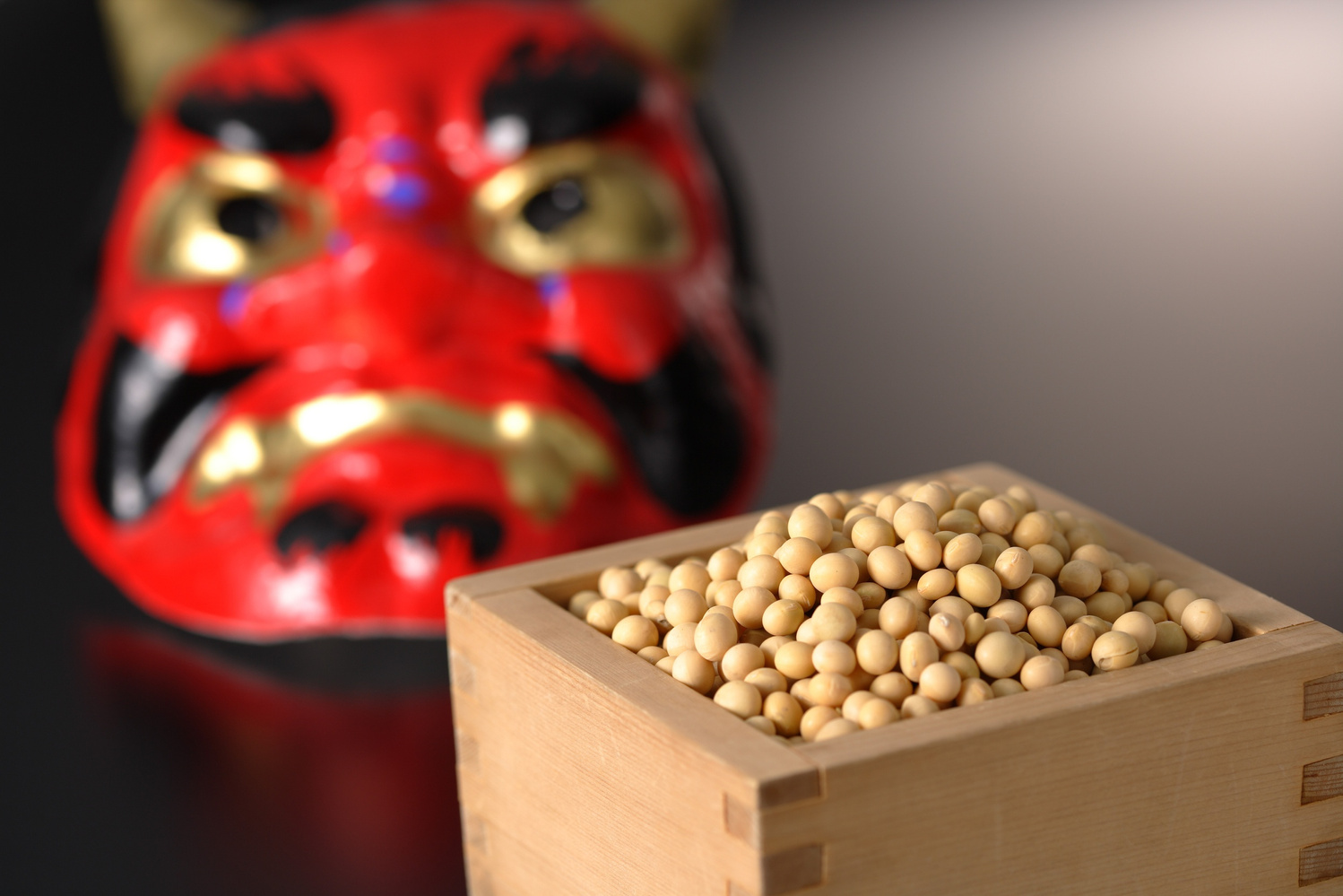 Japanese Setsubun Ritual with Soybeans and Oni Mask